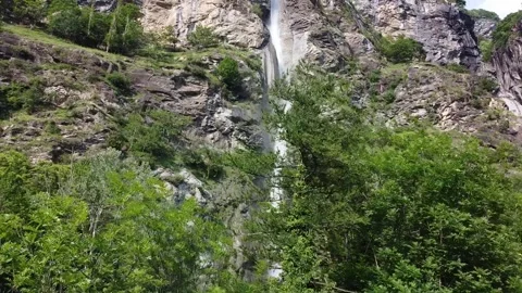 Aerial side view from drone of Cascata Di Novalesa waterfall Stock Footage 247837088