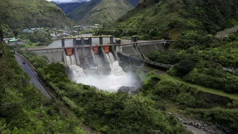 Aerial side view, flying towards a large hydroelectric dam Stock Footage 154698046