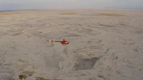 Aerial side view of a helicopter taking tourists for a scenic flight over the Video stock 107226662