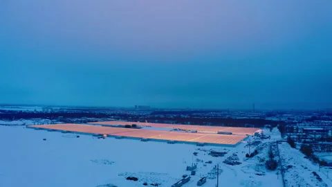 Aerial side view of large industrial greenhouses for growing plants in winter 스톡 동영상 149587737