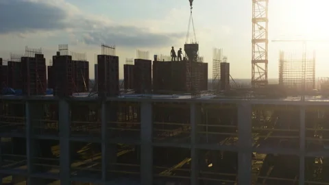 Aerial side view of monolithic frame apartment building under construction Stock Footage 156941253