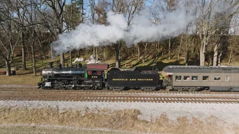 Aerial Side View in Slow Motion, of a Steam Passenger Train Approaching, Bl.. Stock Footage 246427431
