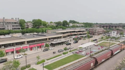 Aerial side view of train passing by near twin cities of Minnesota, USA Stock Footage 284189914