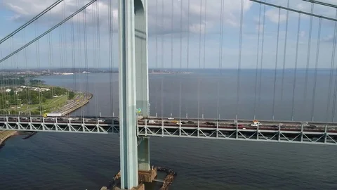 Aerial side view of the Verrazano Bridge New York Stock Footage