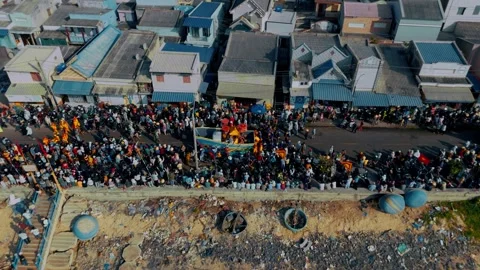 Aerial sideway: Model boat parade at Nghinh Ong Festival in Phuoc Hai, Vietnam Stock Footage 334452315