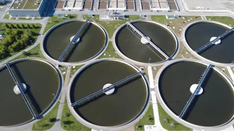 Aerial Sideways Flight Over Circular Sewage Clarifiers in Munich Stock Footage 347685331