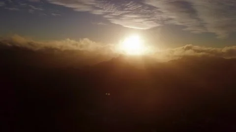 Aerial sideways in mist looking at peak at sunset in Canary Islands 4K Video stock 101565915
