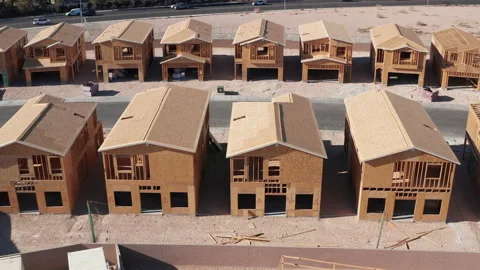 Aerial sideways top down view of wooden house construction in Las Vegas Stock Footage 200231489