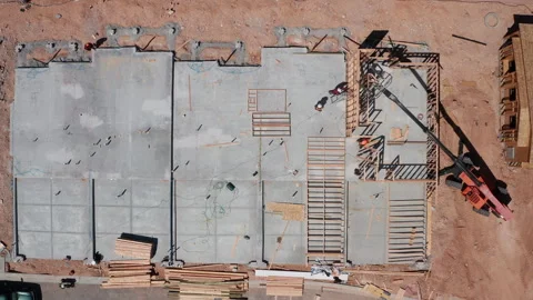 Aerial sideways view of Las Vegas residential home construction with hard hats Video stock 308819821