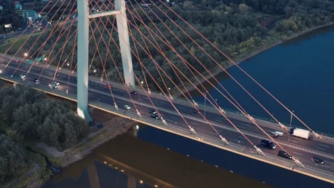 Aerial of Siekierkowski bridge and Vistula river in Warsaw during sunset 動画素材 80010257