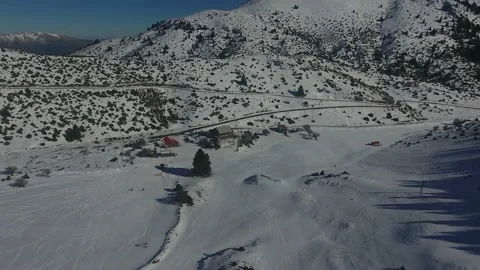Aerial from ski resort approaching facilities Stock Footage 217392995
