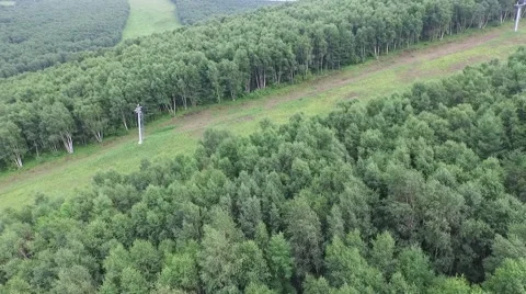 Aerial of ski resort in summer, alpine meadow Stock Footage 59552075