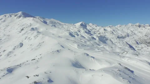 AERIAL: Ski slope in snowy mountains Stock Footage