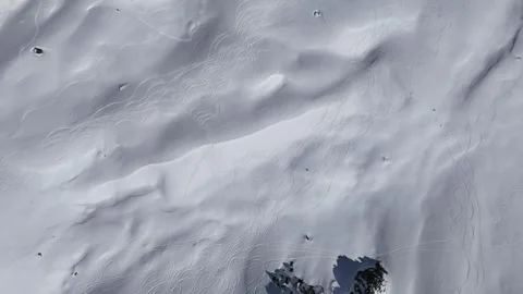Aerial ski slopes of ski slopes in the mountains by winter Stock Footage 335887841
