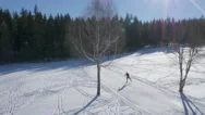 Aerial Of Skier Skiing On Ski Slope On A Sunny Winter Day Stock Footage