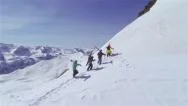 Aerial: Skiers Hiking Uphill, Carrying The Skis Stock Footage