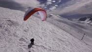 Aerial Of Skiers Paraskiing On Ski Slope Stock Footage