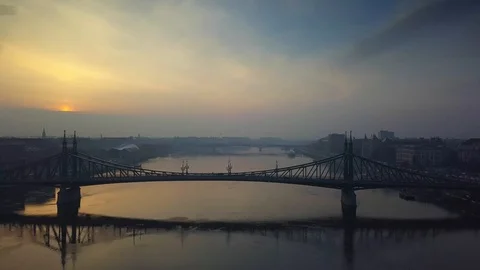 Aerial skyline view about drone flying over of Liberty Bridge at sunrise Stock Footage 85703360
