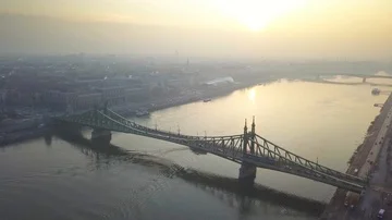 Aerial skyline view about drone flying over of Liberty Bridge at sunrise Video stock 85703385