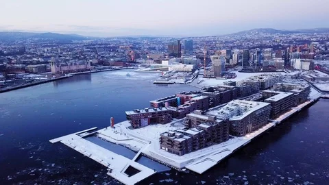Aerial sliding shot of Lambda museum along houses in Sorenga at sunset in Oslo Stock Footage 86331310