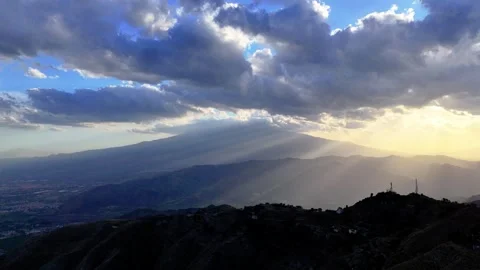 Aerial sliding view of Mount Etna from the East, sun covered by clouds 動画素材 299342022