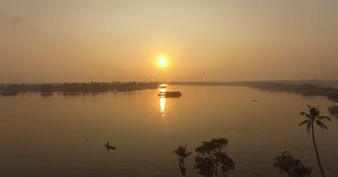 Aerial sloe moving shot over backwaters at sunrise in India Stock Footage 61551069