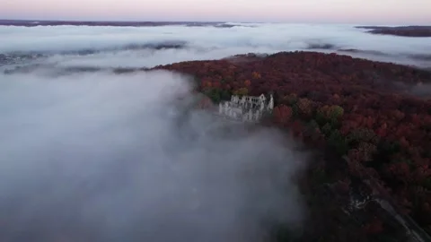 Aerial Slow Epic Low Clouds Mist Sunrise Fantasy Landscape Castle Ruins Stock Footage 256172174