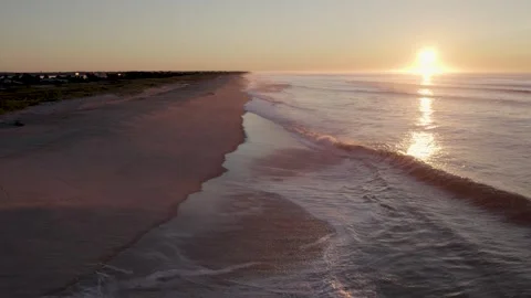Aerial Slow Forward over Ocean Waves at Sunrise - Beach Seascape Stock Footage 328333607