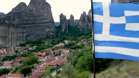 Aerial Slow Motion Fly Backwards to Reveal Extreme Close Up Greek Flag Blow.. Vídeo Stock 334896634