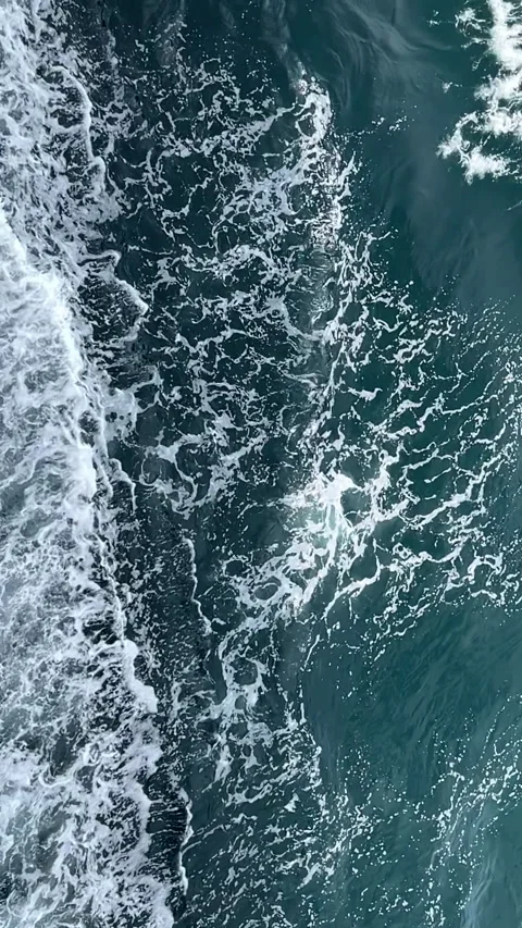 Aerial Slow Motion Ocean Waves with White Sea Foam on Dark Blue Water Stock Footage 334369929