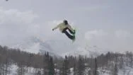 Aerial Slow Motion: Pro Snowboarder Jumping Big Air Kicker Stock Footage
