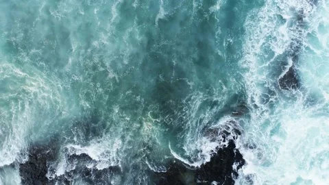 Aerial Slow Motion Shot Of Waves Rushing Towards Rocky Shore Stock Footage 79646967