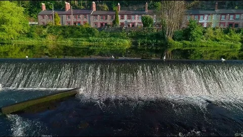 Aerial slow motion of small waterfall Stock Footage 75348290