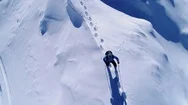 Aerial, Slow Motion - Top Down Close Up Of Man Hiking On Top Of Snowy Mountain Stock Footage