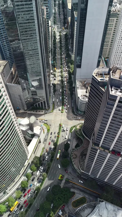 Aerial Slow Motion View Tilting Down Over Makati City Roads Manila Philippin Stock Footage 326735689
