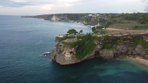 Aerial slow orbit left over Balangan Beach cliffs, Bali Stock Footage 329004323