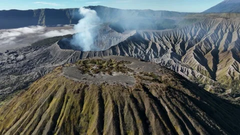 Aerial Slow Orbit of Smoking Mount Bromo Active Volcano Crater, East Java Vídeos de archivo 341857387