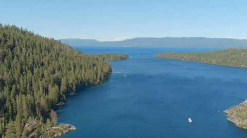 Aerial slow pull away shot of Lake Tahoe, California on a sunny day. Stock Footage 315472537