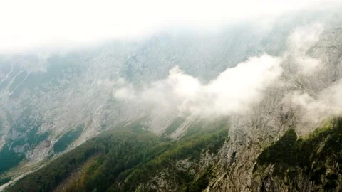 Aerial Slow Push In Shot Of Clouds That Touches the Edge of the Mountain Stock Footage 210772290