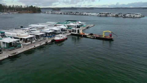 Aerial Slow Rotating Backaway Of two Work Boats Moored To The Dock. 4K Stock Footage 152422567