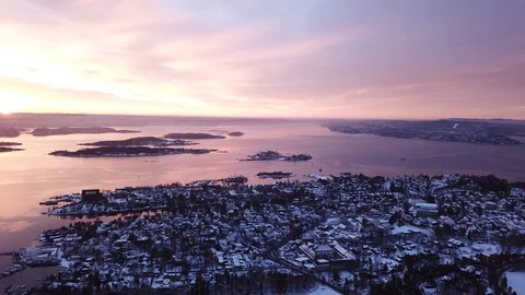 Aerial slow rotating to the left shot of Oslofjord at sunset in Oslo, Norway Stock Footage 102709770