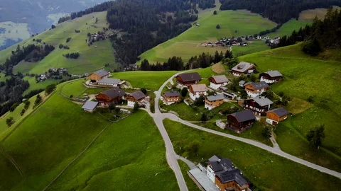 AERIAL small green alpine village dolomites mountain costamesana Italy Stock Footage