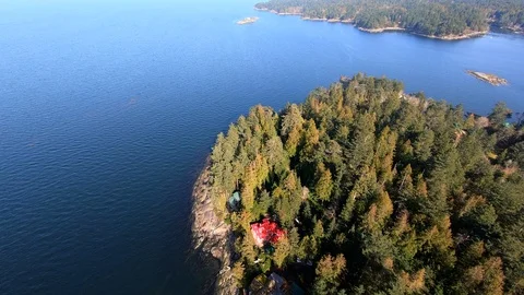 Aerial Small Island Top Down View Trees Cabins Blue Ocean Background Landscape Stock Footage 107485227