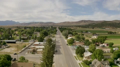Aerial-Small mountain town Main Street North end-Low sun angle Video stock 202096053