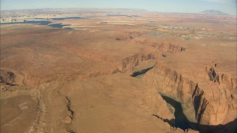 Aerial of small river stream flowing through rocky mountains valley Stock Footage 109146545