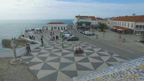 Aerial of small square and surrounding areas of small city above ocean water Stock Footage 157102397
