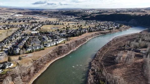 Aerial small town overlooking river valley with bike paths and golf course. Stock Footage 292323652