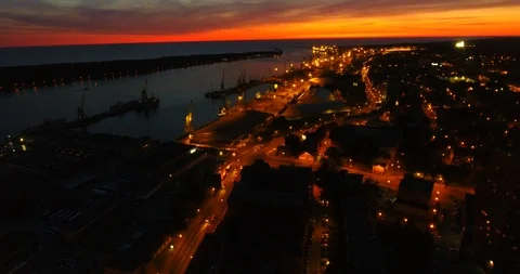 AERIAL. Smooth drone flight through Klaipeda City port at night. Sunset. Video stock 90644828