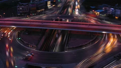 Aerial Smooth Time Lapse Interchange Road Traffic At Night Video stock 212193983