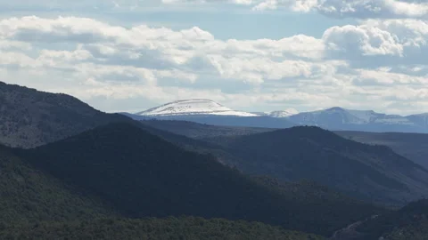 Aerial of snow capped Uinta mountain near Flaming Gorge in north Utah in spring 動画素材 334815538